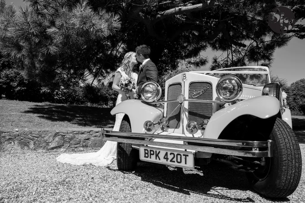 Beauford Wedding car with couple in Sussex